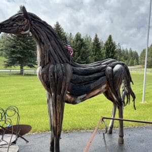 A horse statue made out of tires.