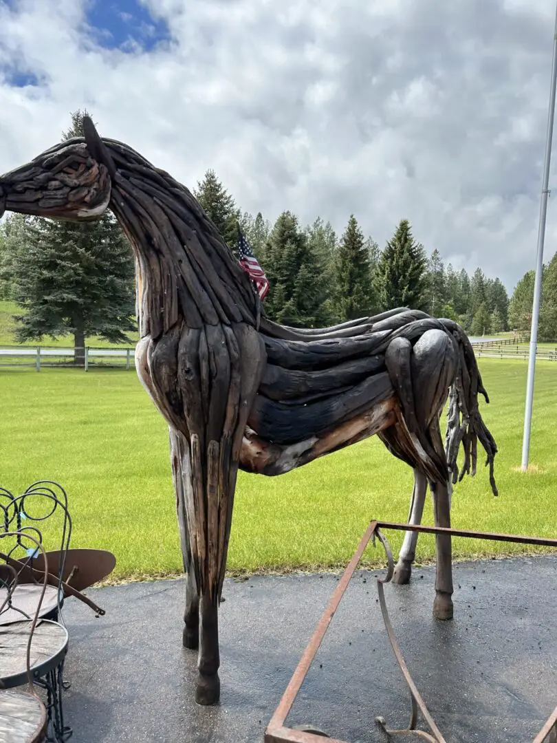 A horse statue made out of tires.