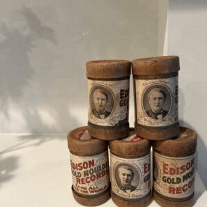 A group of six rolls of edison gold record.