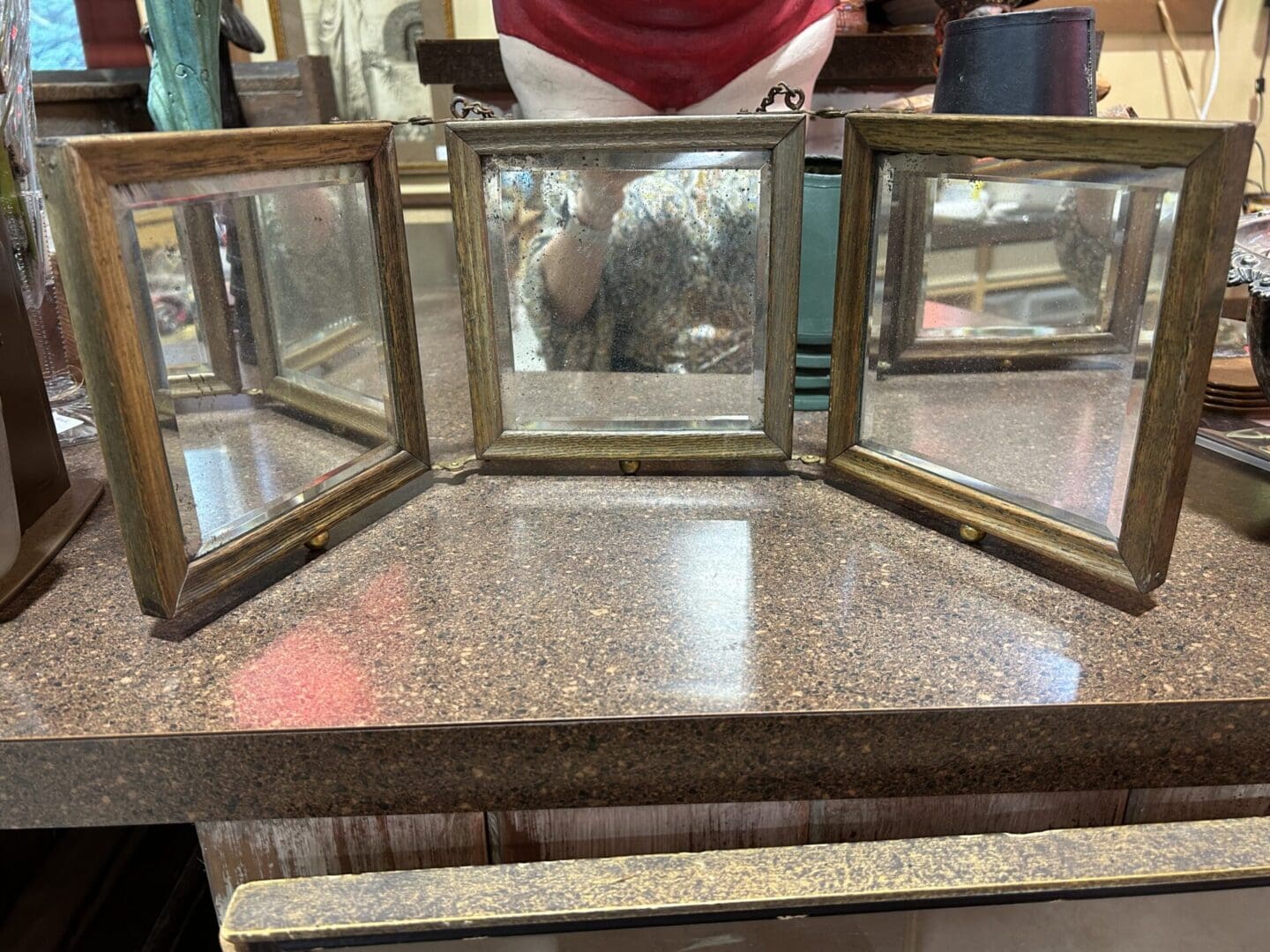 A table with three mirrors on it